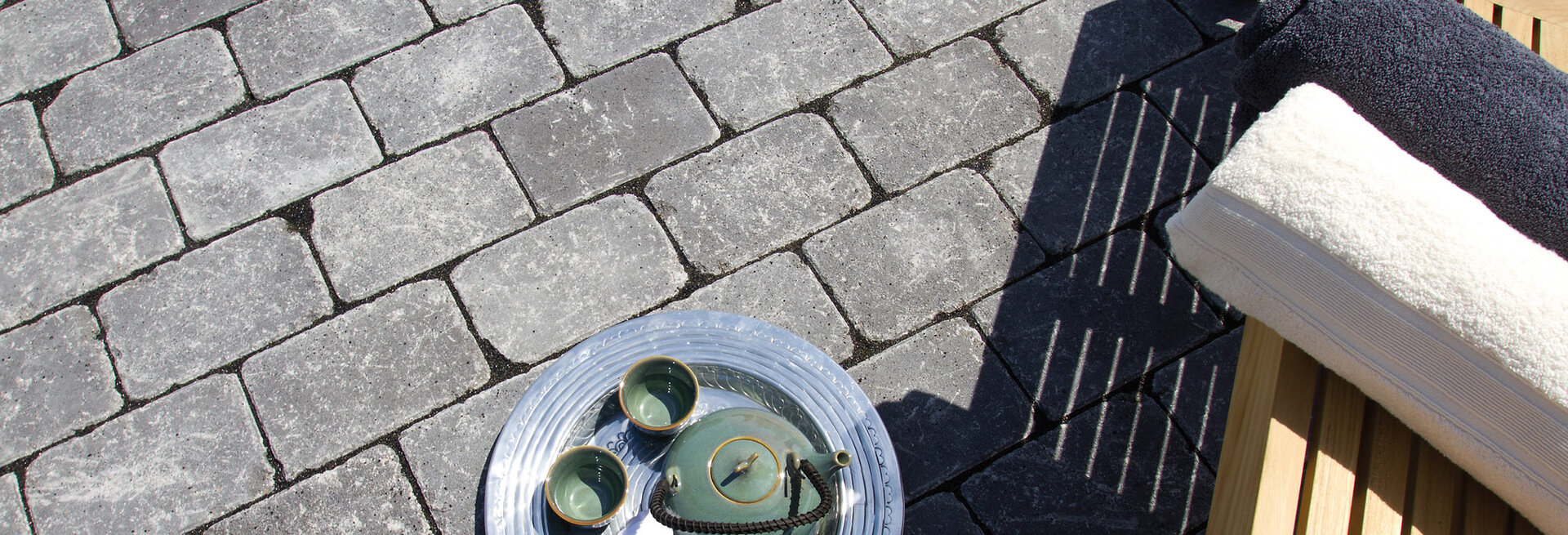 Slider Bild des Pflastersteins Rainplus System16 Rocca anthrazit